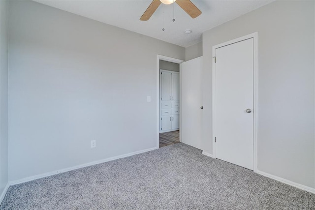 unfurnished bedroom with carpet floors and ceiling fan