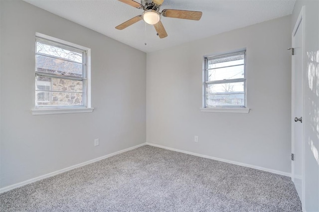 carpeted empty room with ceiling fan