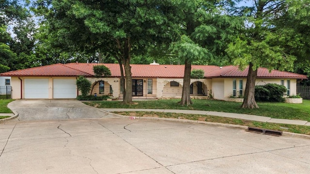 view of front facade with a front lawn and a garage