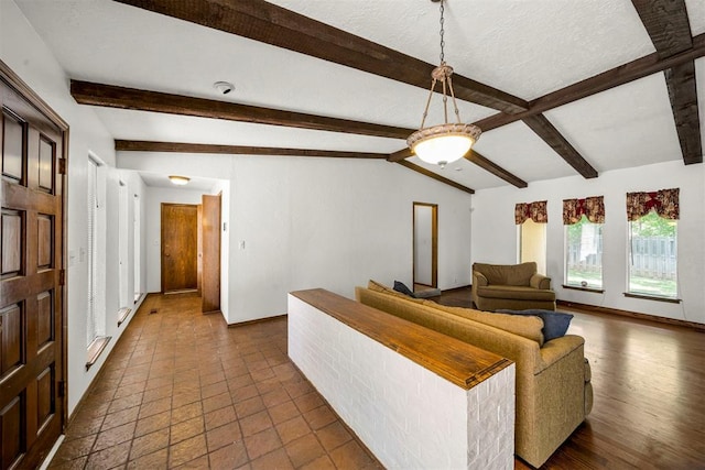 living room with lofted ceiling with beams