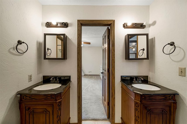 bathroom with vanity and a textured ceiling