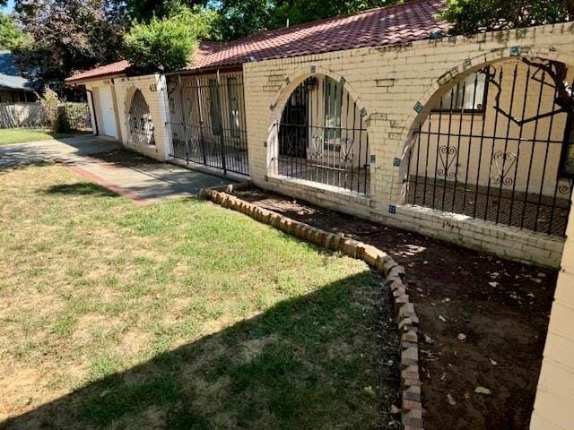 exterior space with a lawn and a garage