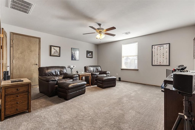 carpeted living room featuring ceiling fan