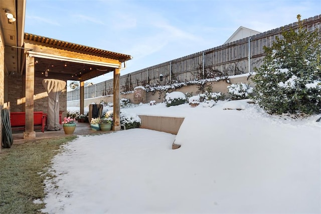 view of yard layered in snow