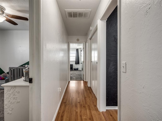 corridor featuring light hardwood / wood-style flooring