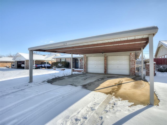 view of snow covered garage