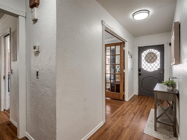 foyer entrance with light hardwood / wood-style flooring