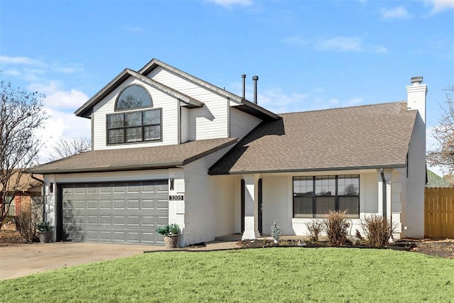 front facade featuring a garage and a front lawn