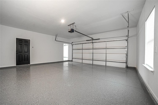 garage featuring baseboards and a garage door opener