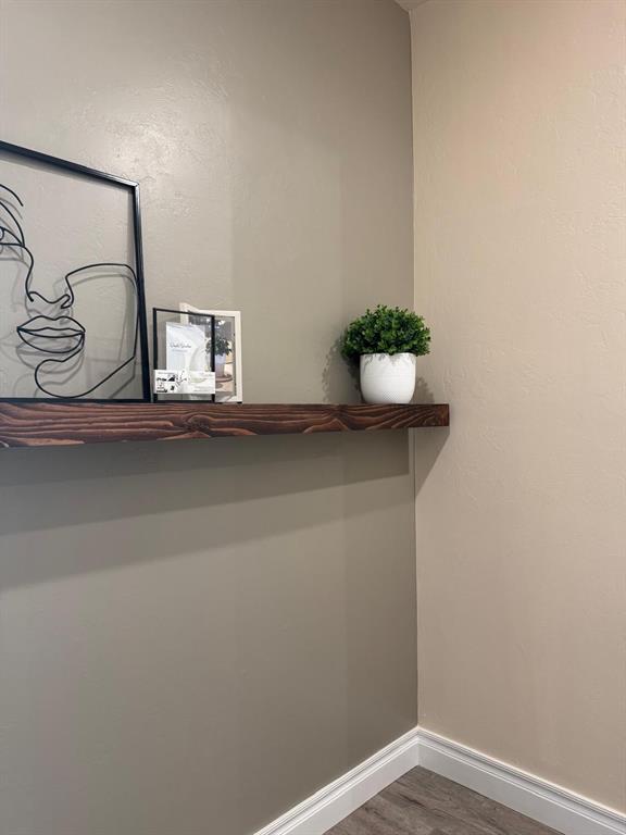 room details featuring wood finished floors and baseboards