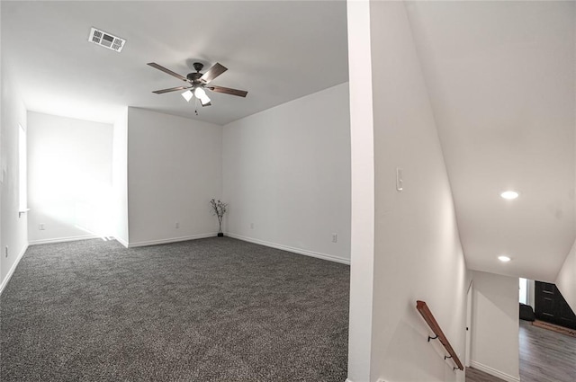 unfurnished room with baseboards, visible vents, a ceiling fan, dark colored carpet, and recessed lighting