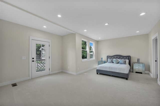 carpeted bedroom featuring access to outside