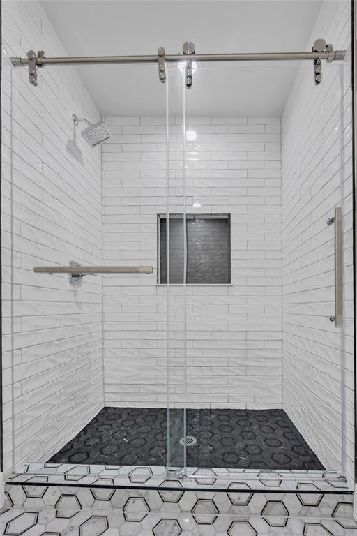 bathroom featuring walk in shower