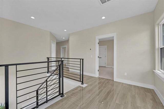 hall with light wood-type flooring