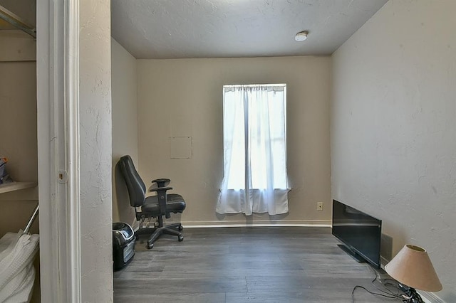 office with hardwood / wood-style flooring