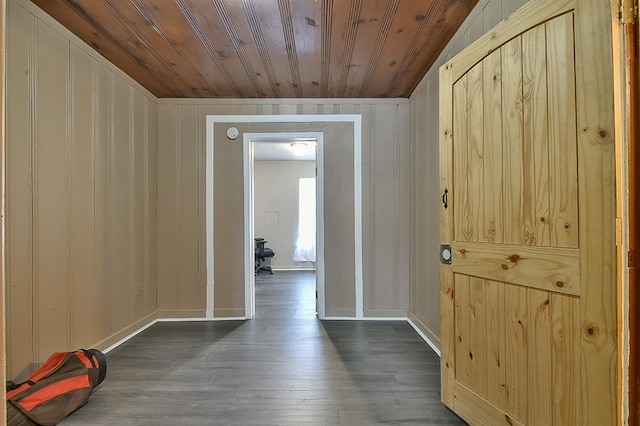 corridor with wood ceiling and dark hardwood / wood-style floors