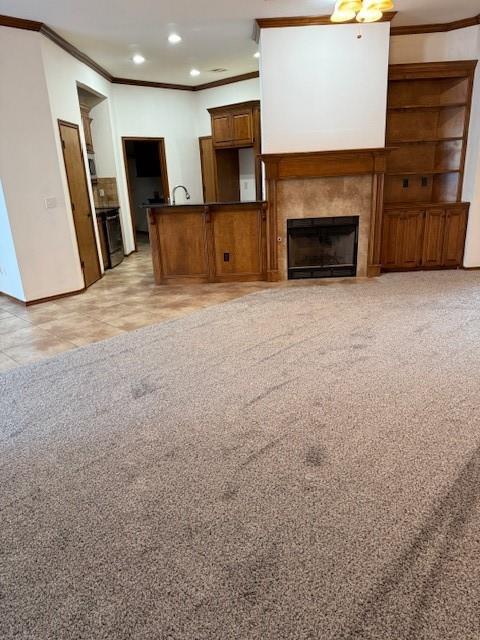 unfurnished living room with ornamental molding