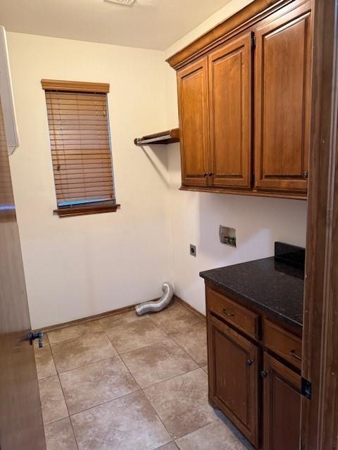 laundry area featuring hookup for a washing machine, cabinets, and hookup for an electric dryer