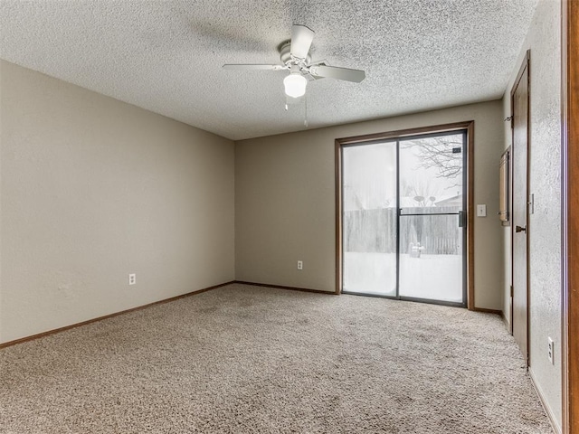 spare room with ceiling fan, a textured ceiling, and light carpet