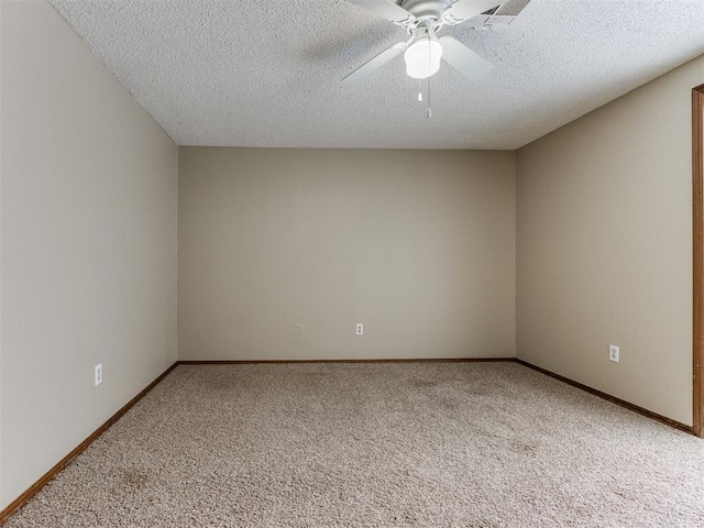 unfurnished room with ceiling fan, a textured ceiling, and carpet