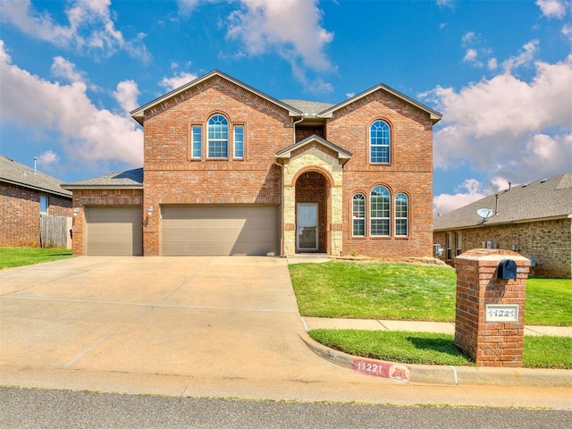 view of front facade featuring a garage and a front yard