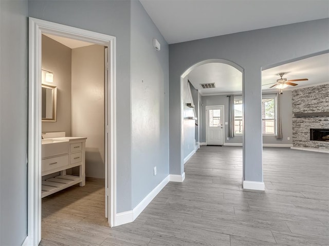 hall with light hardwood / wood-style flooring