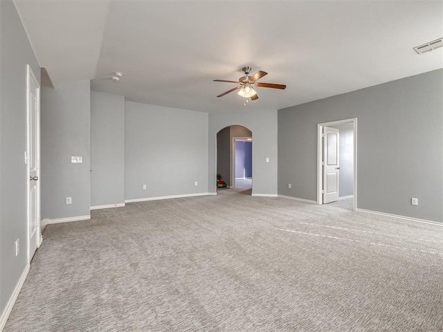 empty room featuring light carpet and ceiling fan