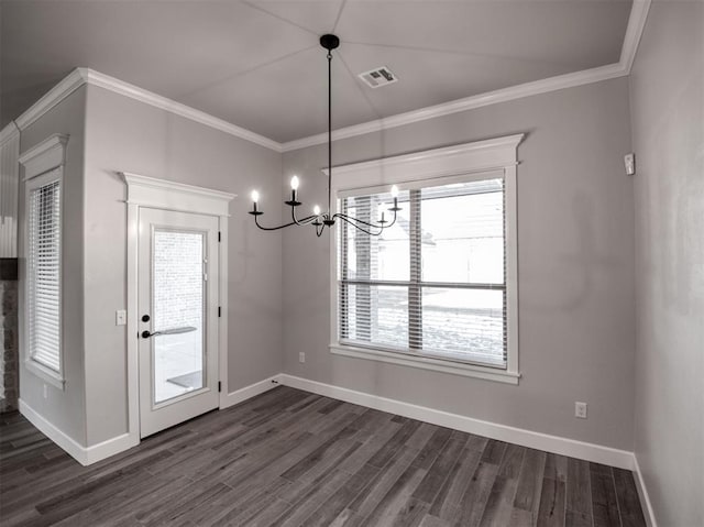 unfurnished dining area featuring dark wood finished floors, visible vents, baseboards, and ornamental molding