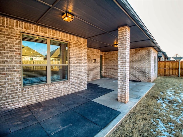 view of patio / terrace featuring fence