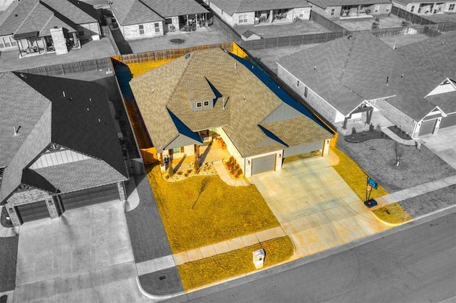 birds eye view of property with a residential view