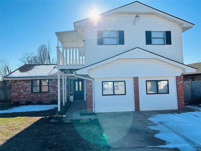 view of front of house featuring a balcony