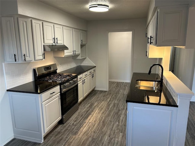 kitchen featuring white cabinetry, stainless steel gas stove, and sink