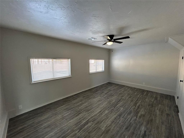 unfurnished room featuring ceiling fan and dark wood-type flooring