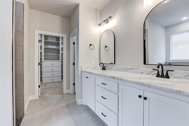 bathroom featuring tile patterned floors and vanity