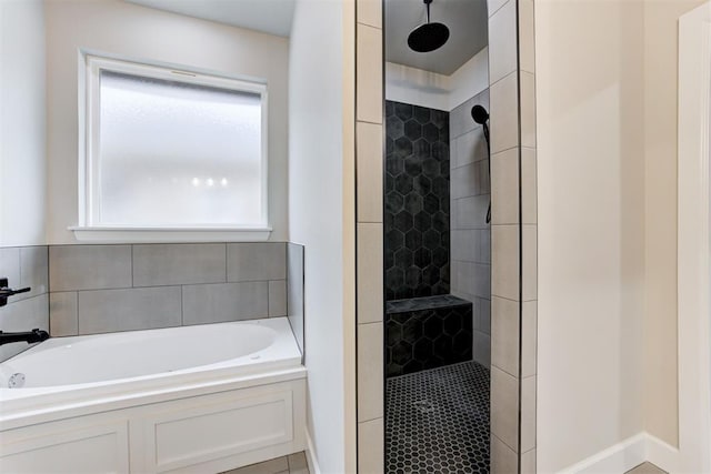 bathroom featuring tile patterned flooring and independent shower and bath