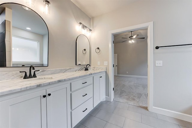 bathroom with tile patterned floors, ceiling fan, and vanity