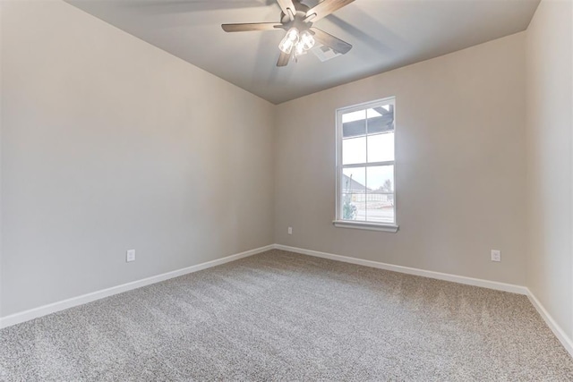 carpeted empty room featuring ceiling fan