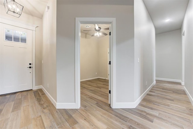 entrance foyer featuring a chandelier and light hardwood / wood-style floors