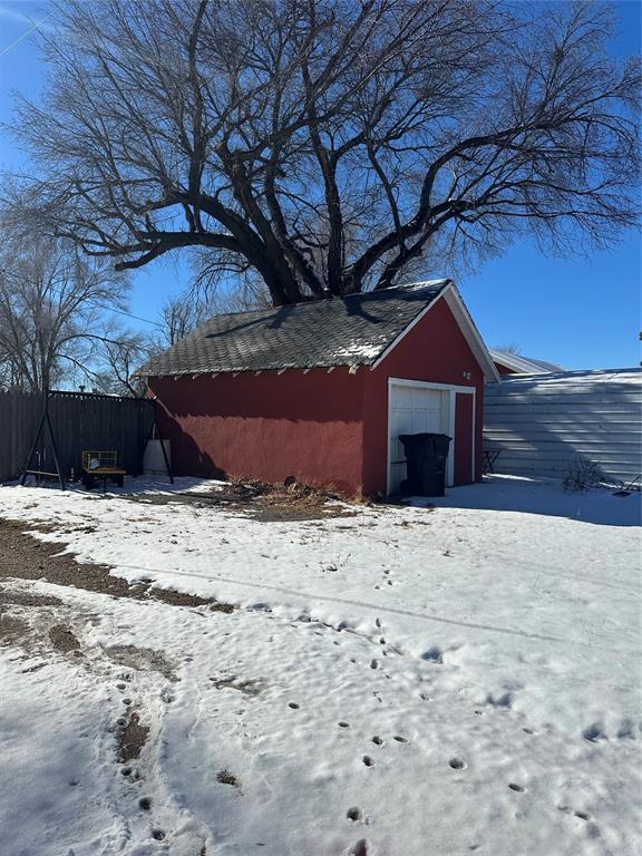 view of snow covered garage