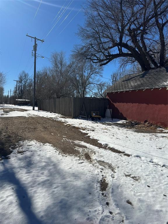 view of yard layered in snow