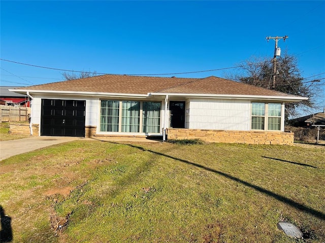 back of property with a yard and a garage