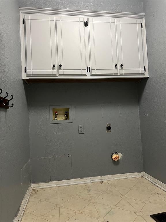 laundry area featuring washer hookup, electric dryer hookup, and cabinets