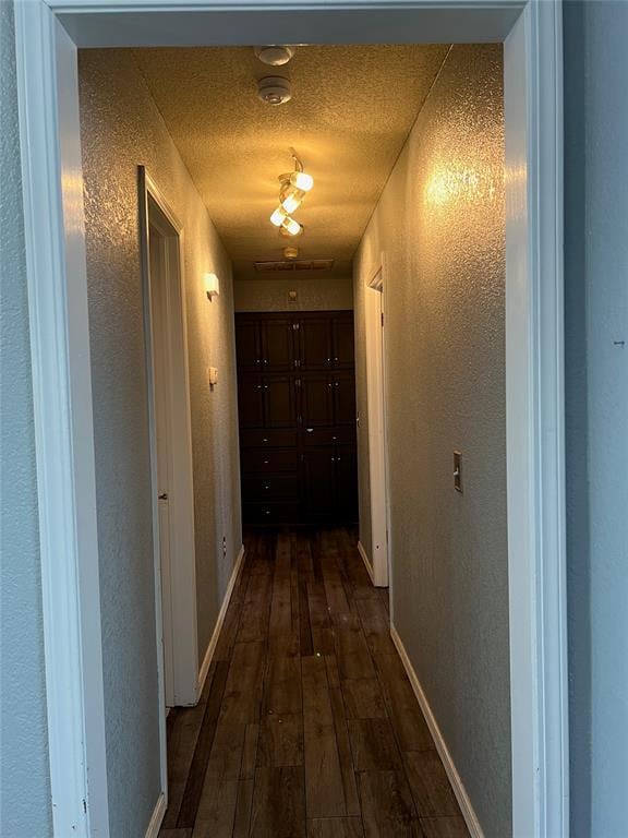 hall with dark wood-type flooring