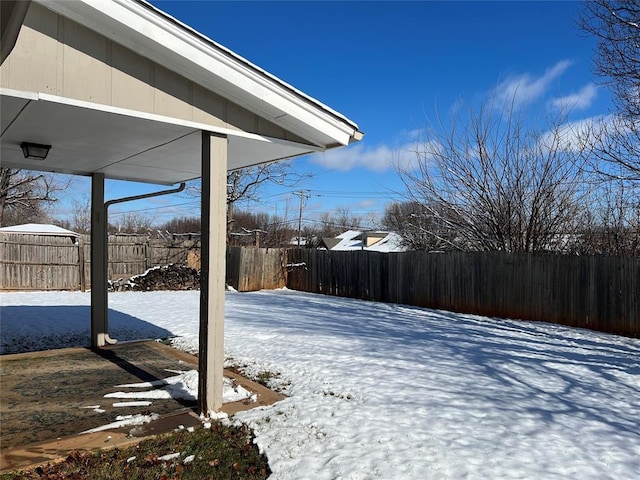 view of yard covered in snow