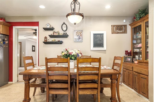 dining room featuring ceiling fan