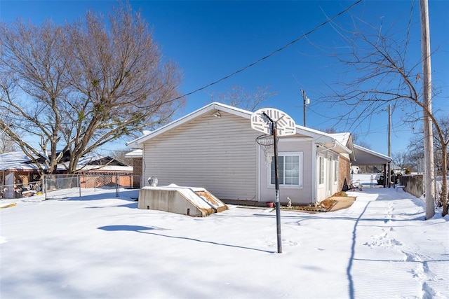 view of snow covered house