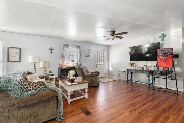 living room featuring hardwood / wood-style flooring and ceiling fan