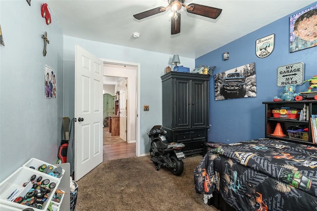 carpeted bedroom with ceiling fan