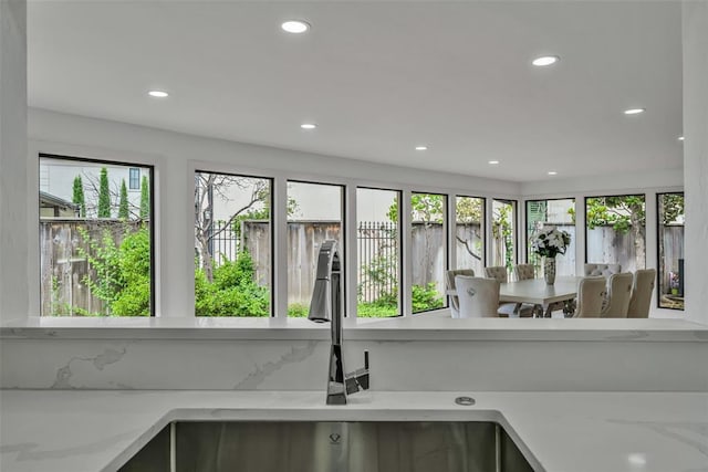 interior details with light stone counters and sink