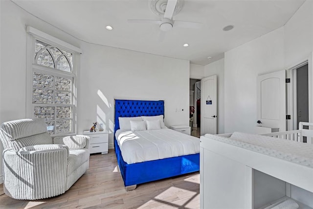 bedroom featuring ceiling fan and light hardwood / wood-style floors